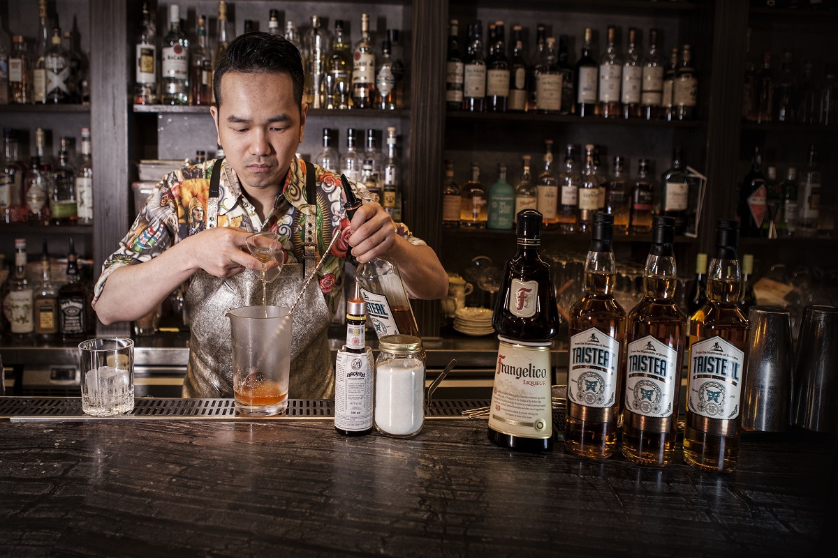 Bartender Using Jigger