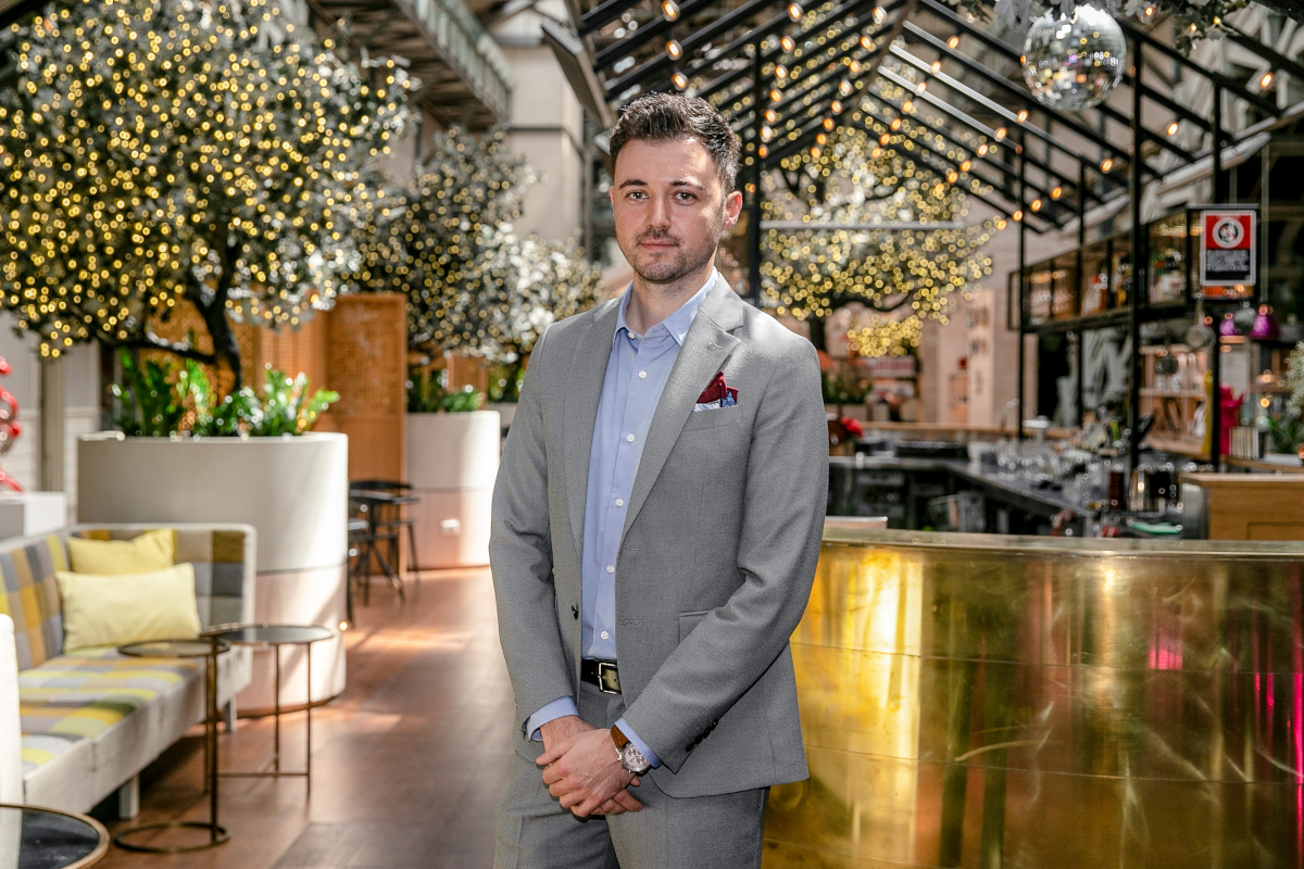 Andrea Gualdi standing in bar