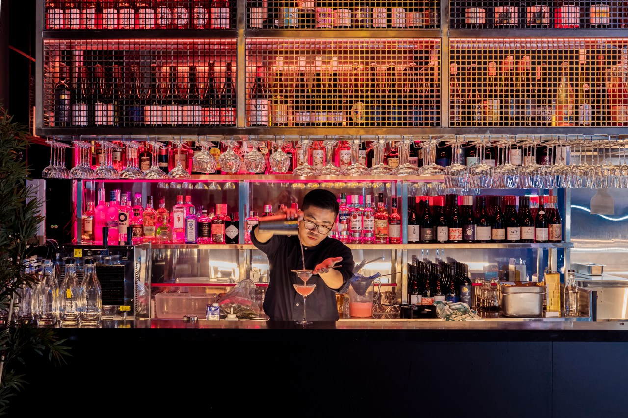 Peter Pham behind the bar at Hey Chu